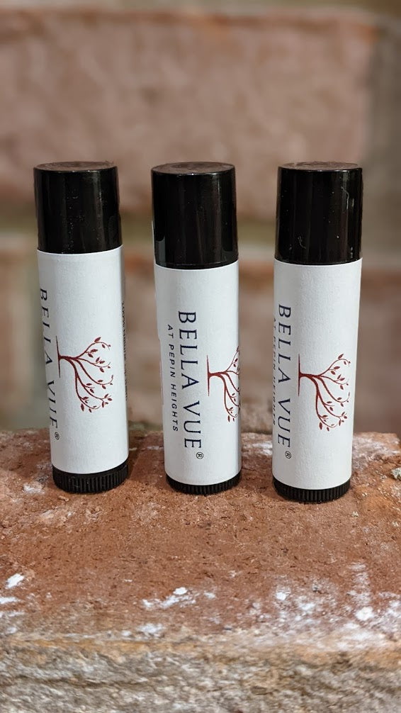 All Natural Lip Balm.  Creamy white balm in black tube with elegant tamper proof label. 